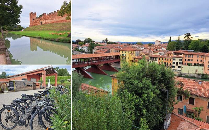 Remparts crénelés au-dessus des douves, vélos électriques devant une cave et pont des Alpini à Bassano