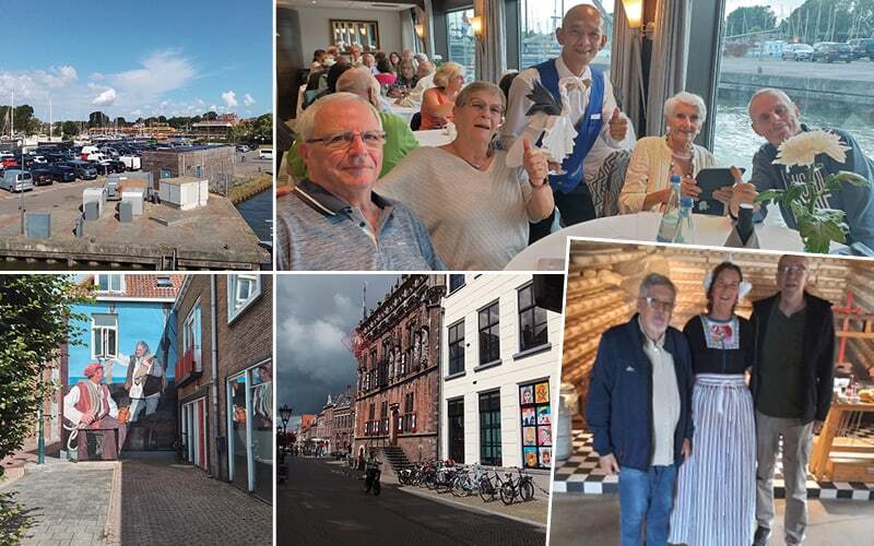 Repas joyeux à bord, façade historique en brique et voyageurs avec une femme en costume traditionnel