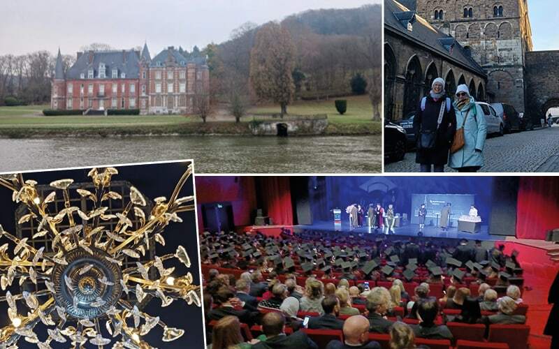 Château de brique au bord du fleuve, lustre doré et salle de spectacle comble