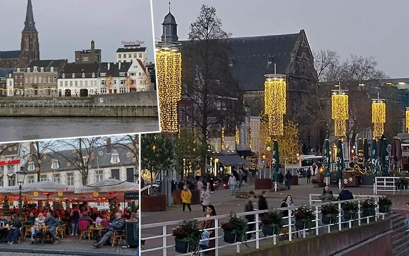 Bords de la Meuse à Maastricht, terrasse de café festive et guirlandes lumineuses sur les quais