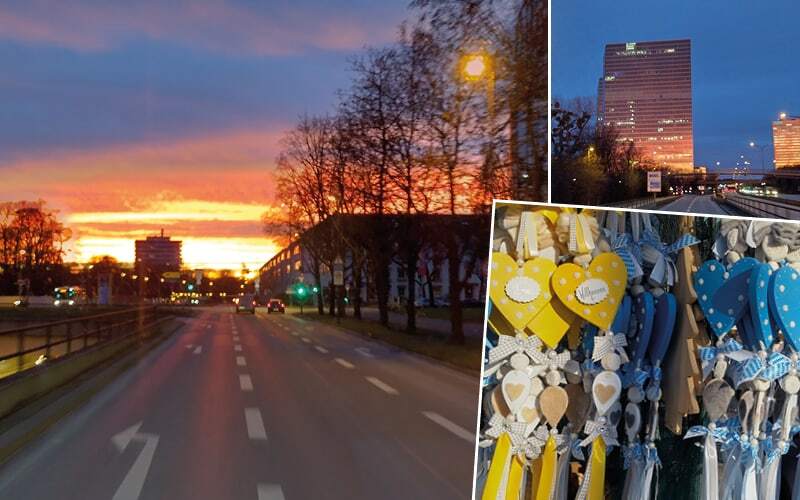 Coucher de soleil sur une avenue de Munich, tour éclairée au crépuscule et cœurs en bois