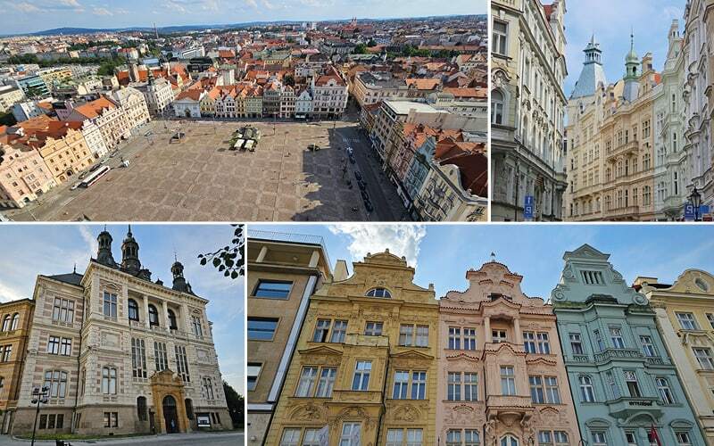 Vaste place pavée vue d’en haut, édifice néo-Renaissance et façades colorées à pignons ornés