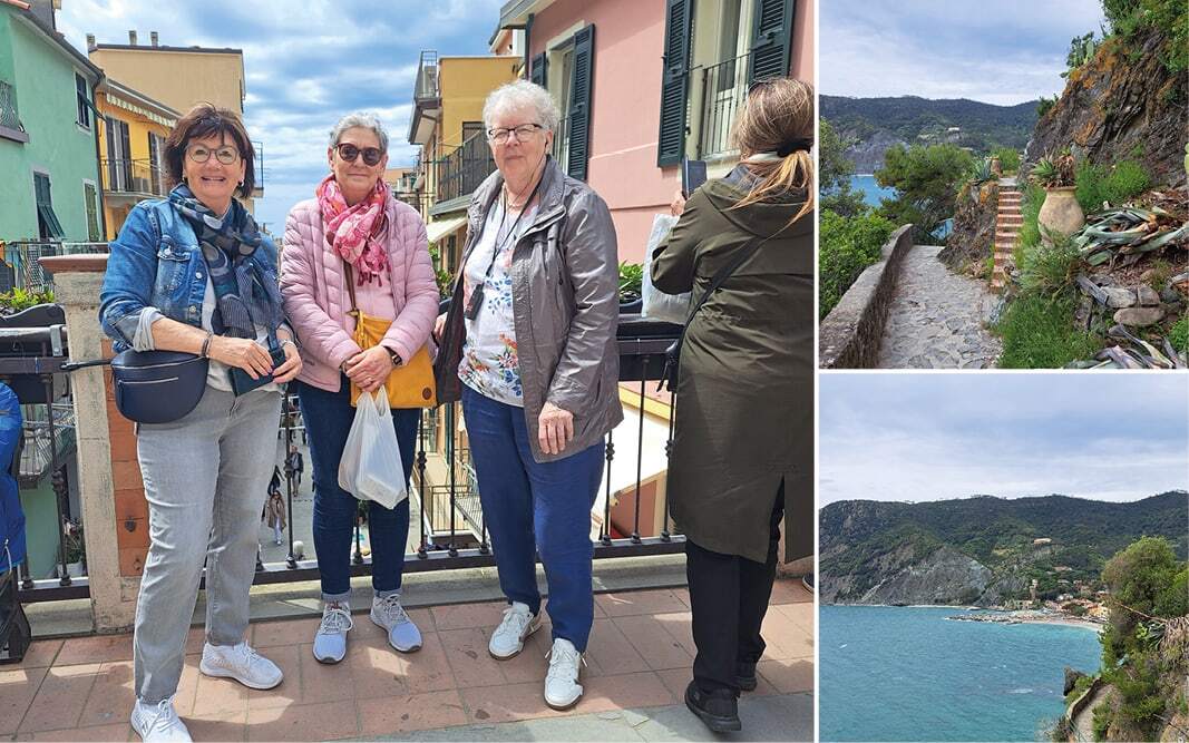 Voyageuses souriantes dans un village coloré, sentier pavé et baie de la côte ligure
