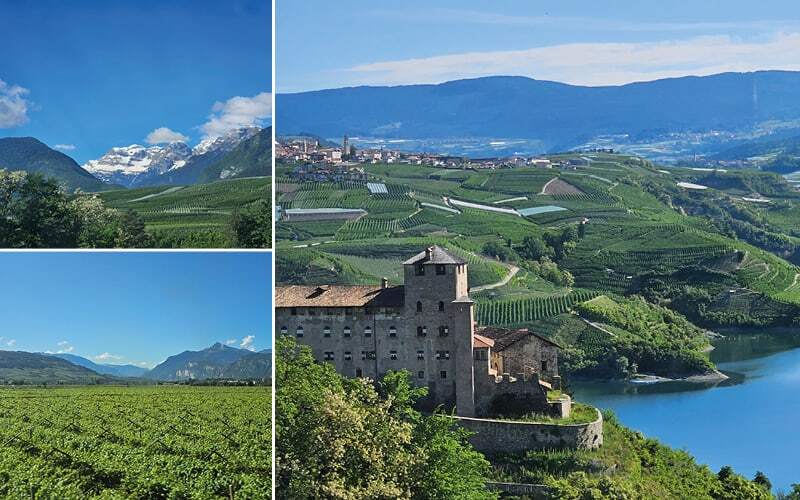 Château dominant un lac et des vergers, vignobles et sommets enneigés en arrière-plan